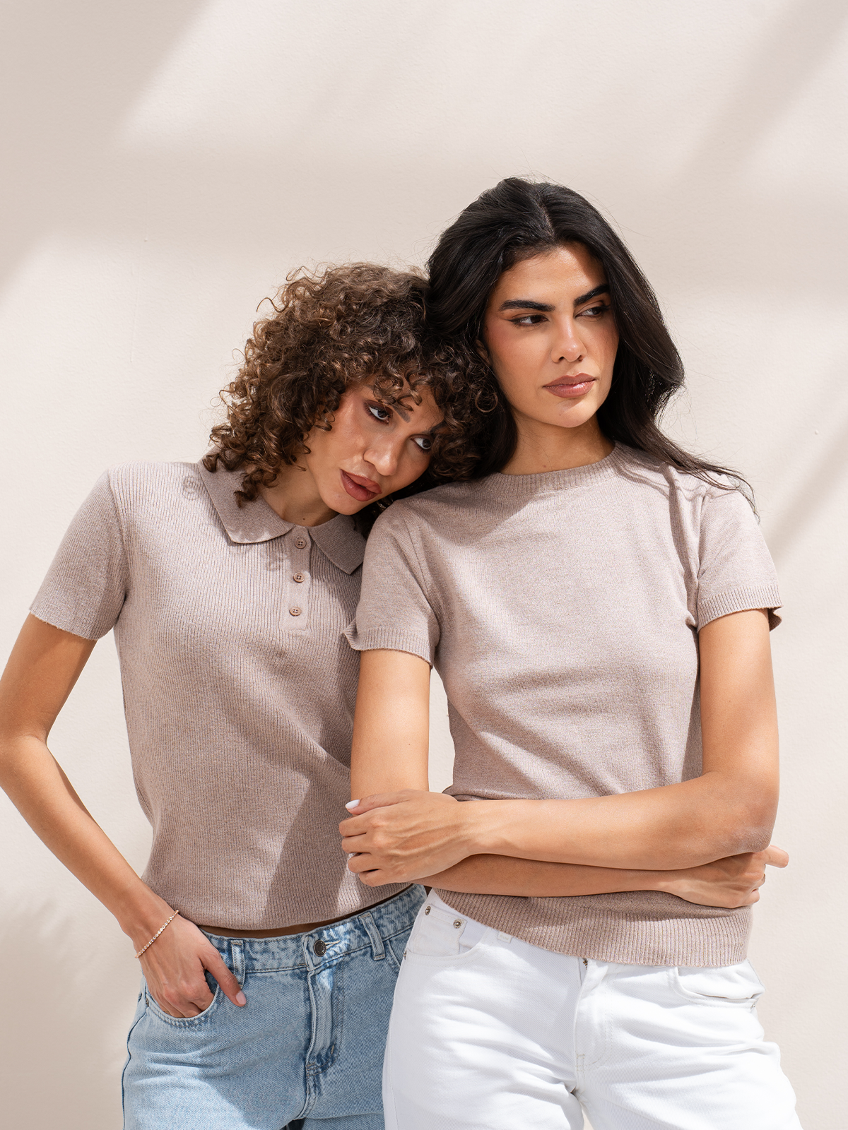 Two women in CLOUD knitted polo and knitted tee